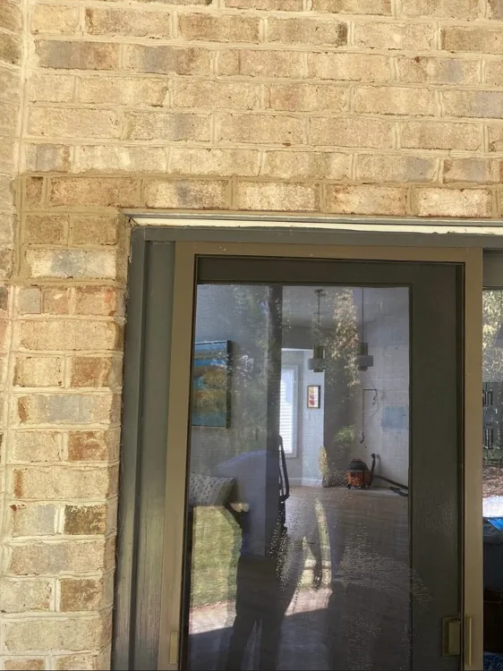 Completed brick surround around a widened exterior door opening